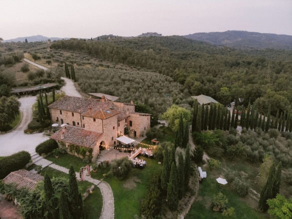 Drone image of splendid outdoor wedding dinner in Tuscany
